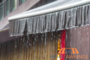 heavy-rainfall-how-fixed-awnings-shield-your-balcony-from-singapore-sun-and-rain-fixed-awning-midas-awnings-singapore