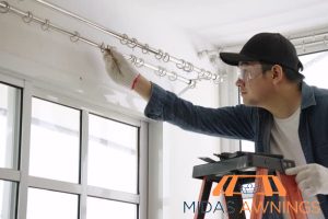 extend-beyond-the-window-frame-for-full-coverage-how-to-choose-the-right-curtain-rod-length-for-any-window-in-your-home-curtain-rod-installation-midas-awnings-singapore