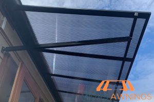 long-term-performance-how-polycarbonate-roofs-perform-during-heavy-rains-and-storms-in-singapore-polycarbonate-roofing-long-form-midas-awnings-singapore