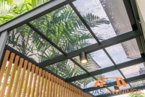 waterproofing-and-leak-resistance-how-polycarbonate-roofs-perform-during-heavy-rains-and-storms-in-singapore-polycarbonate-roofing-long-form-midas-awnings-singapore